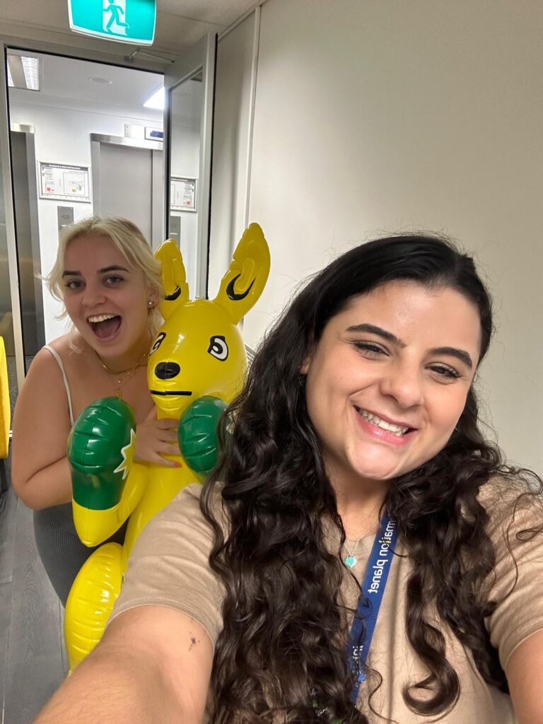 Student-from-Brisbane-at-Information-Planet-office-holding-an-inflatable-kangaroo
