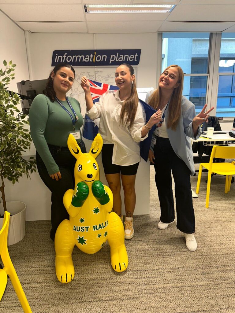 Student-from-Brisbane-at-Information-Planet-office-holding-an-inflatable-kangaroo 2