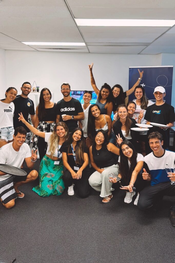 International-students-smiling-with-plates-in-hand-during-a-hospitality-seminar-at-Information-Planet-in-Queensland